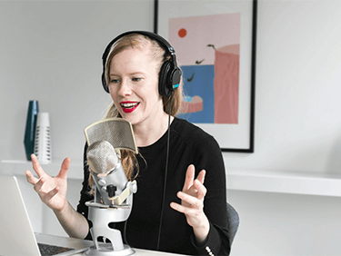 woman-recording-podcast-at-mic